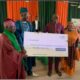 From Right: Managing Director/CEO of Unity Bank Plc, Mrs Oluwatomi Somefun; Regional Manager, Unity Bank, Mr Segun Olarenwaju presenting cheque to the Onifiditi of Fiditi, Oba Sakiru Oyewole Adekola-Oyelere, Ajani-Eedu II and the Chairman of the Committee, Professor John Oluokun during the during the official launch and Groundbreaking of National Open University of Nigeria, Fiditi Study Centre on Saturday at Fiditi Grammar School, Oyo state.